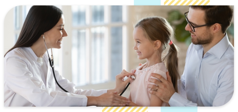 A woman doctor examines a little girl child alongside her father
